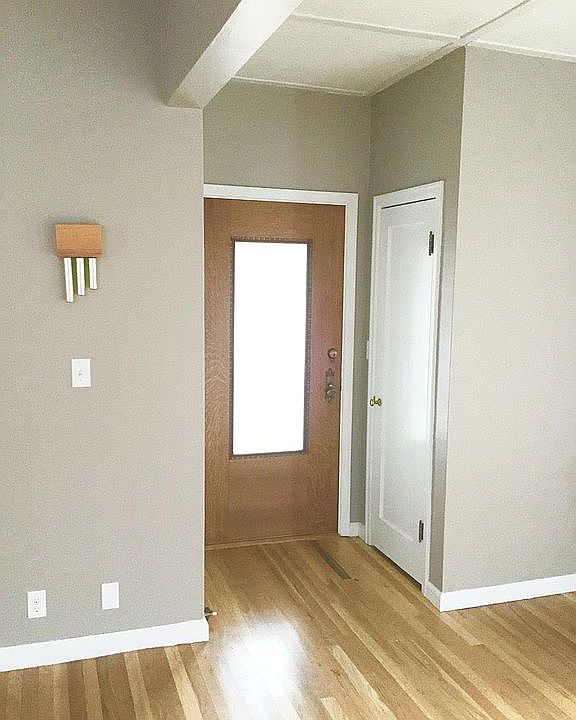 Front entrance inside with deep coat closet.