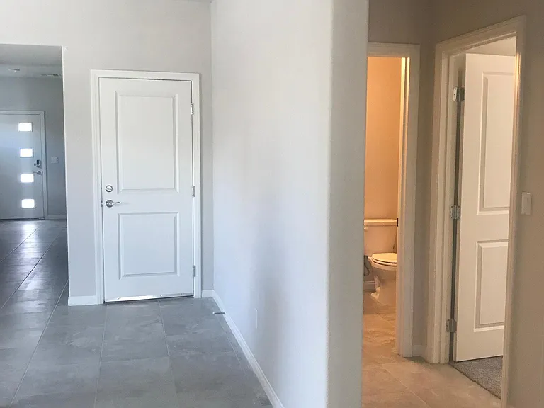 Hallway leading to guest bedroom and downstairs bedroom