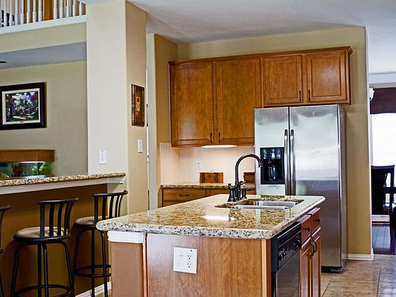 Light and bright kitchen offers lots of counter and storage space creating a chef's dream