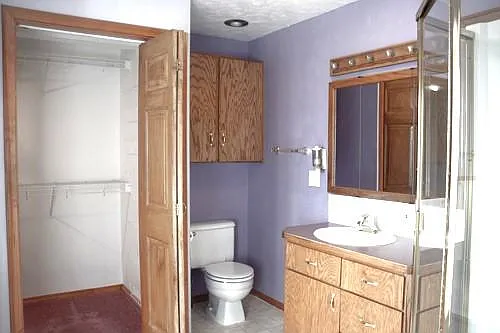 Master bath and walk in closet. Shower to the right, tub to the left.