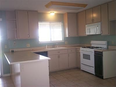 Open kitchen with eat in area.