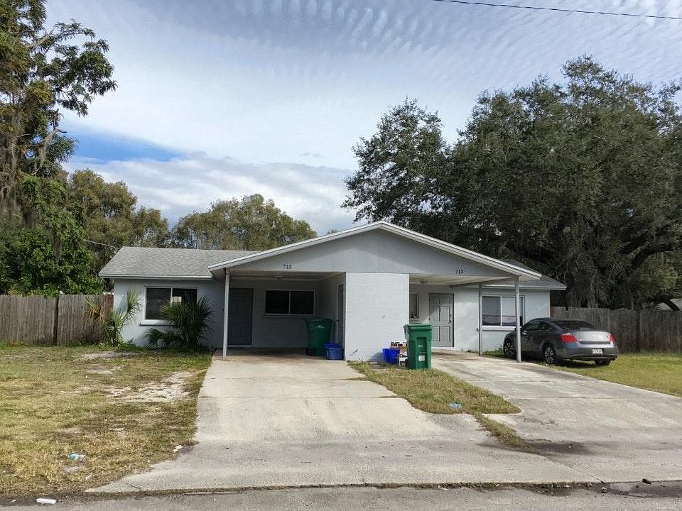 Front with Carport 1