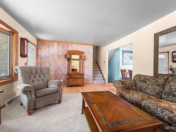 Foyer opens to Living Room, Dining area and stairs.