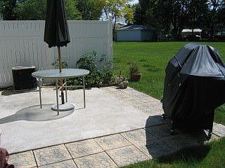 back yard patio w/ garden area