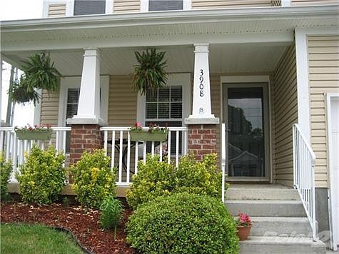 Inviting front porch offers a place to sit and have your coffee.