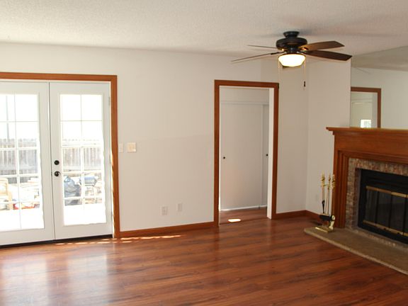 Living room French door leading out to Trex Deck and Fenced in Backyard.
