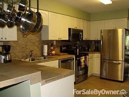 New Kitchen : New tile floors and counter tops, stainless steel appliances.