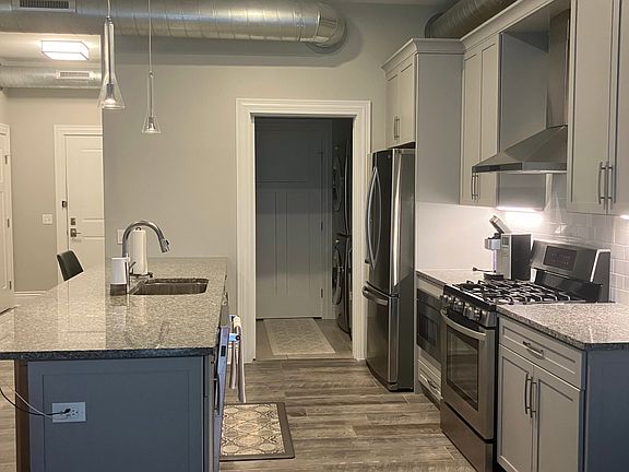Kitchen area with laundry room off kitchen