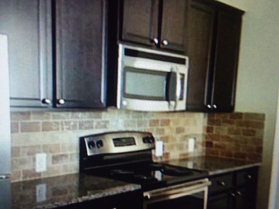 Expresso Chocolate Cabinets with stone Backsplash!!