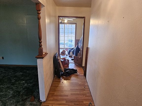 Walk Into Front Door, View to Kitchen, and Formal Living room on left.