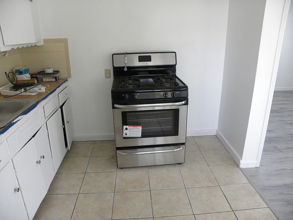KITCHEN AREA NEW STOVE. NEW COUNTERTOP AND SINK, WORK IN PROGRESS!