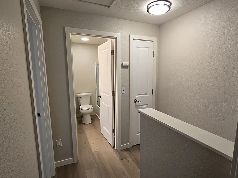 Top of the stairs. Linen closet and peak to bathroom