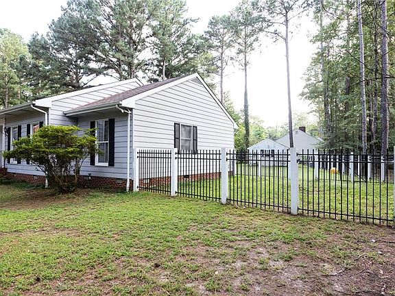 Fenced yard includes a separate fenced area, good for dogs.