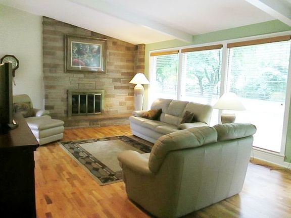 Another view of the living room showing the beautiful windows.