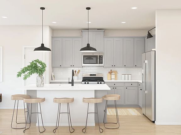 Kitchen with pendant lighting and center island - Artist Rendering