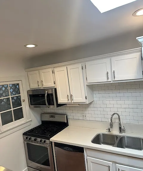 Kitchen with quartz countertops and stainless steel appliances