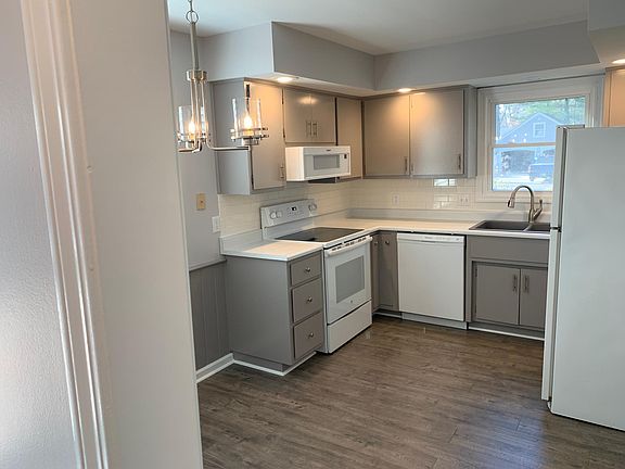 Remodeled kitchen with new range, granite sink, large pantry