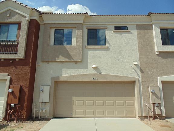 Rea of unit with access to private, two car garage.
