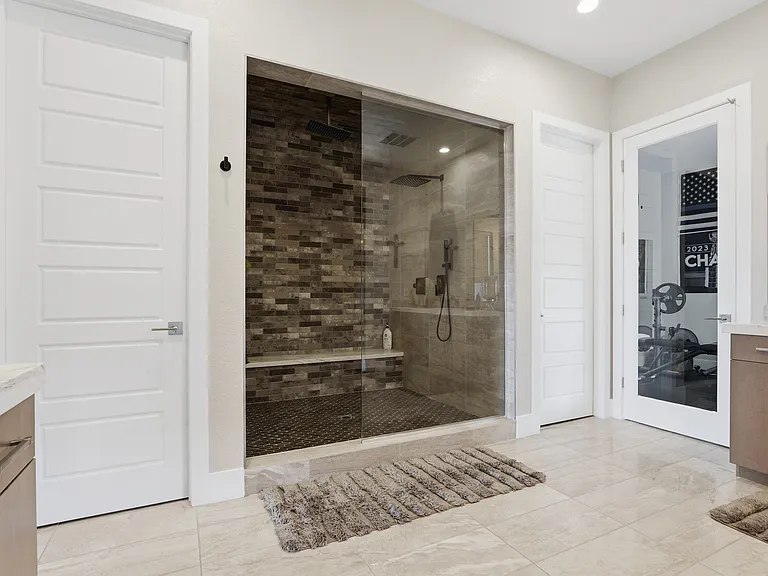 #GuardianRealty 10941 Earth Hues Summerlin Luxury Home Rental primary bathroom shower_06232026