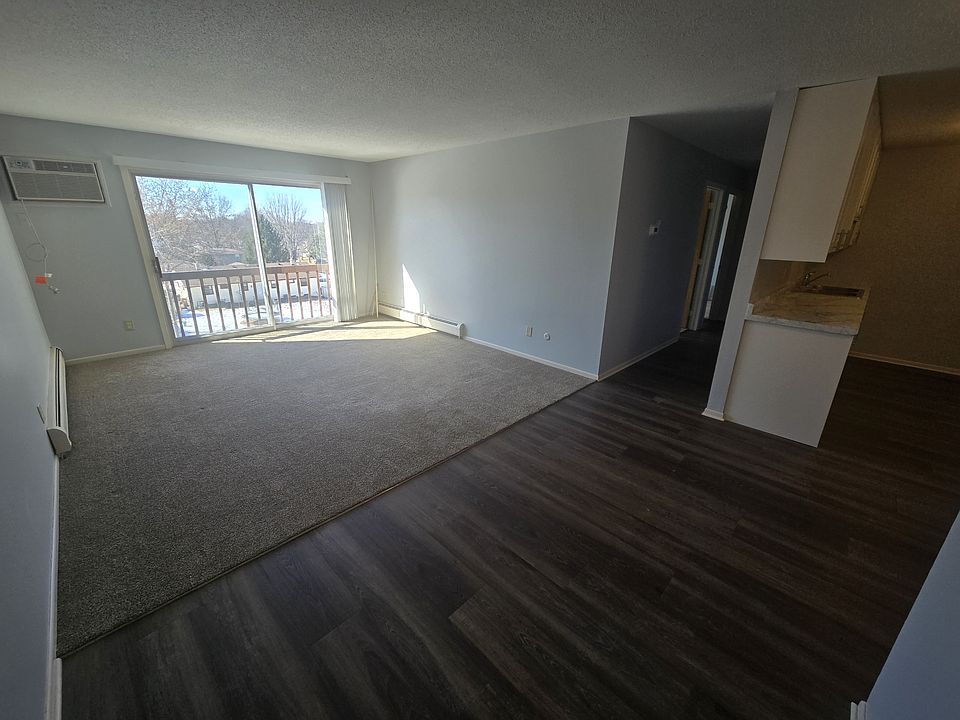 Living room with a great view and AC. New carpet and LVP flooring throughout the unit.