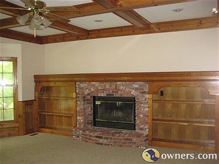 Family room with built in bookcases and fireplace