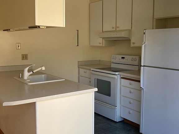 The kitchen- includes oven/stove, refrigerator, dishwasher, and garbage disposal.