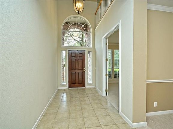 As you enter you will be welcomed by a cathedral ceiling in the foyer, neutral colors and a tile entryway.
