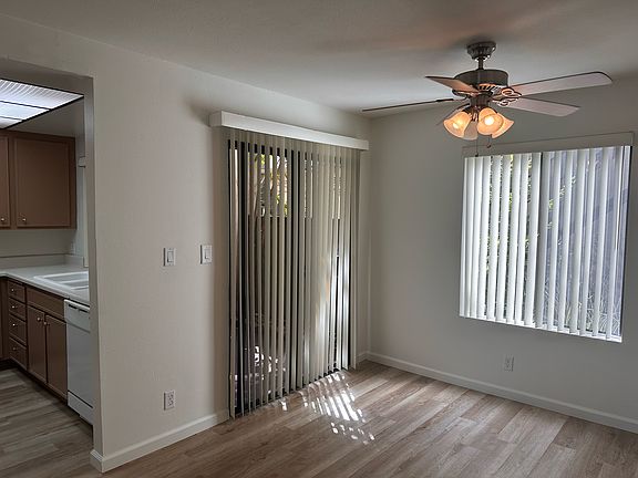 Dining area and kitchen to the left. Patio entrance to the right.