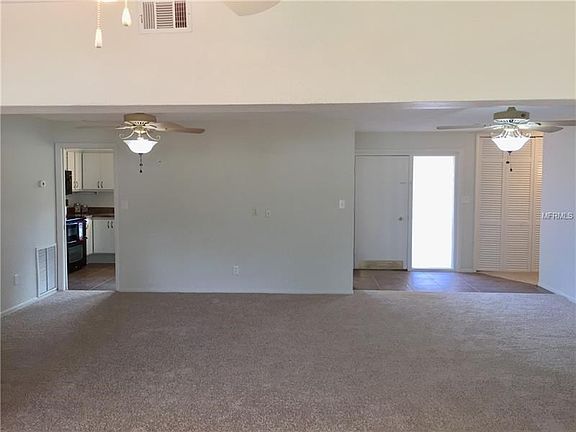 View from Great Room to kitchen and front door.