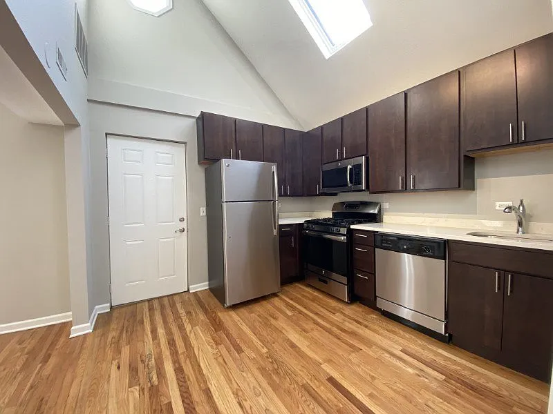 Large kitchen with hardwood floors