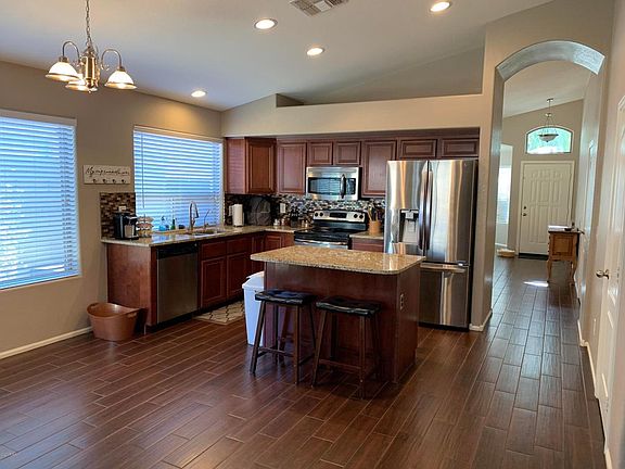 Kitchen with granite and all stainless appliances.