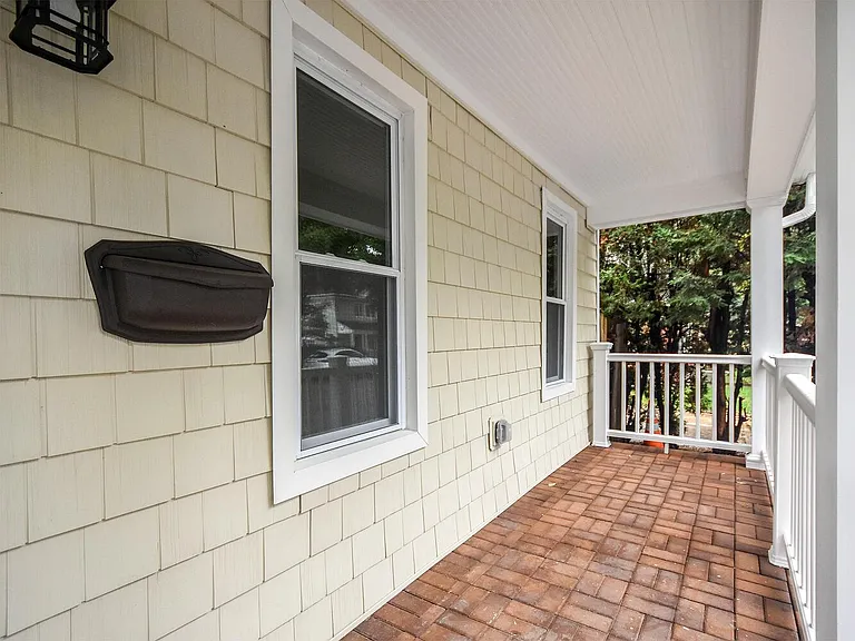 Imagine relaxing at your rocking chair on this porch