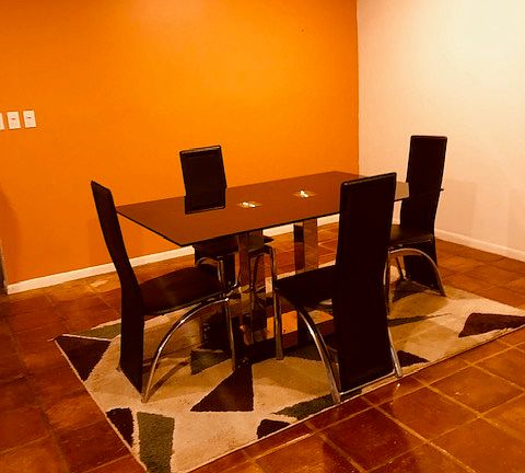 Dining room; furniture and area rug come with the house