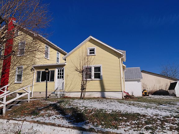 Side view from Grafton Street. The rental is the structure to the right. The white door is the outside entrance of the sunporch that is included with this rental.