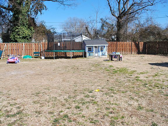 Back yard, playhouse include