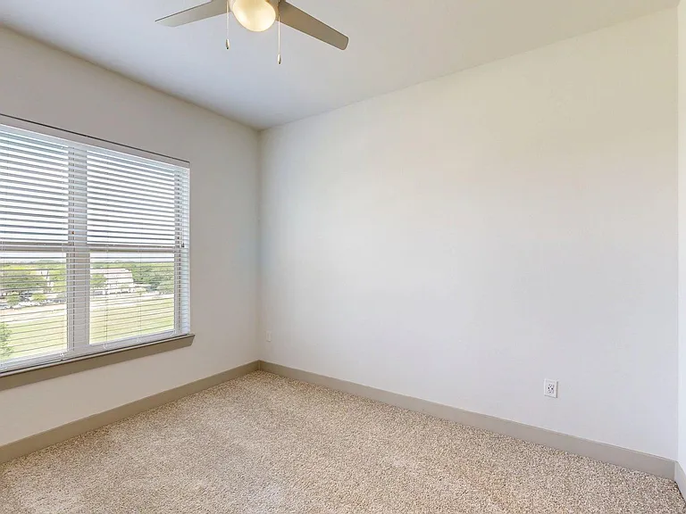 Spacious apartment Bedroom with Carpet Floor.