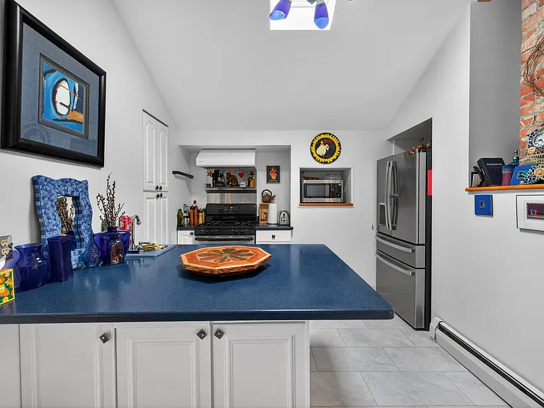 Full size refrigerator with hands free automatic filtered water dispenser.