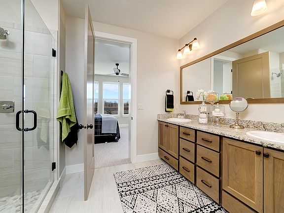 Master bedroom ensuite bathroom with spacious walk in closet.