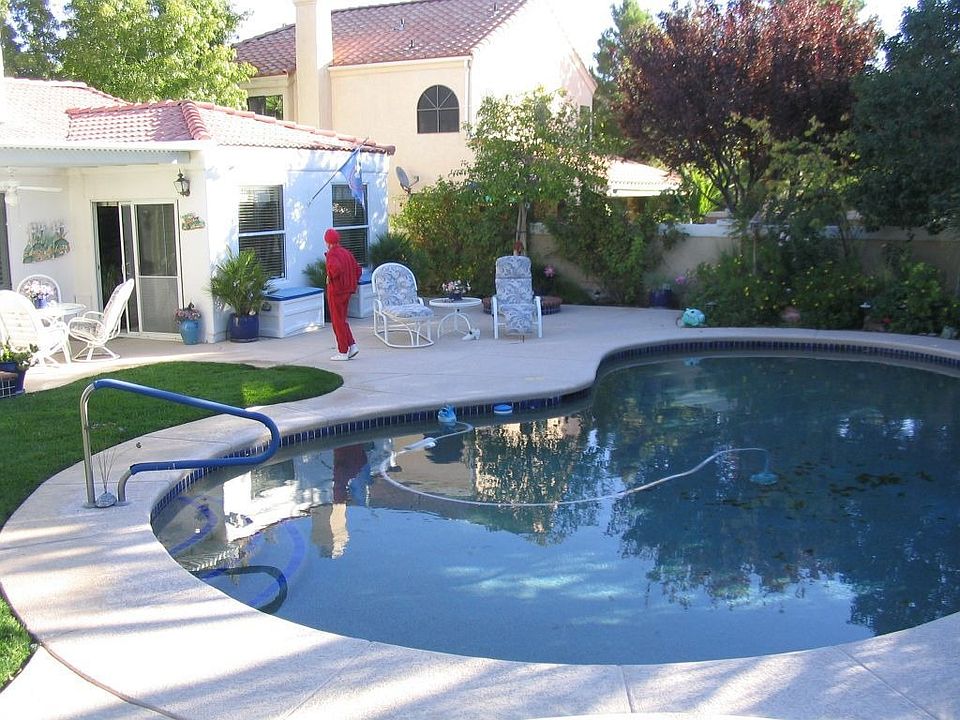 Large backyard with pool and spa