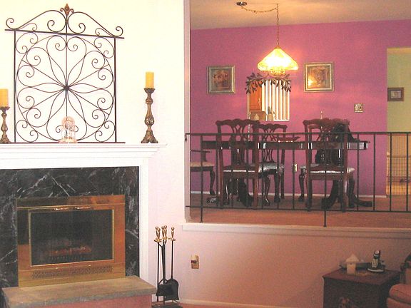 Sunken Living Room with fireplace and formal dining room