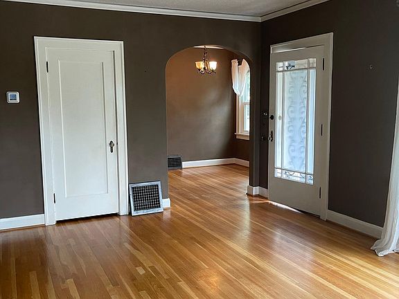 front door, archway to dining room, huge entry closet