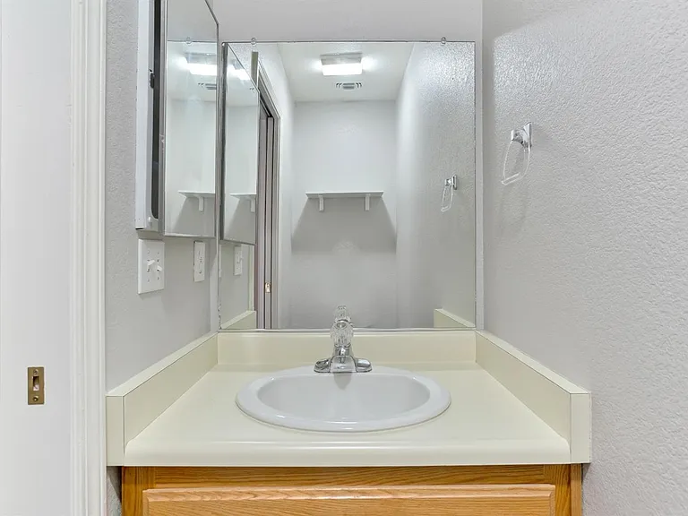 The downstairs bathroom, located near the front entrance of the home.
