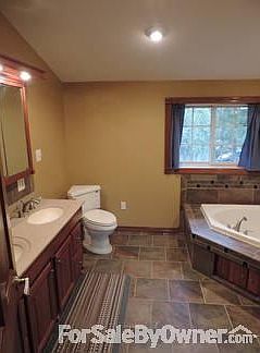 Master Bathroom
						:
						Large 11'x12', tiled bath, jetted tub, dual sink, large shower with seat.