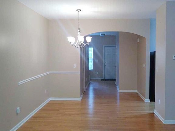 Looking to front door from patio doors in back