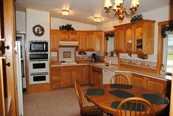 A quick right turn upon entering gets you into the kitchen and eating area. Many of the cupboards have internal lighting.
