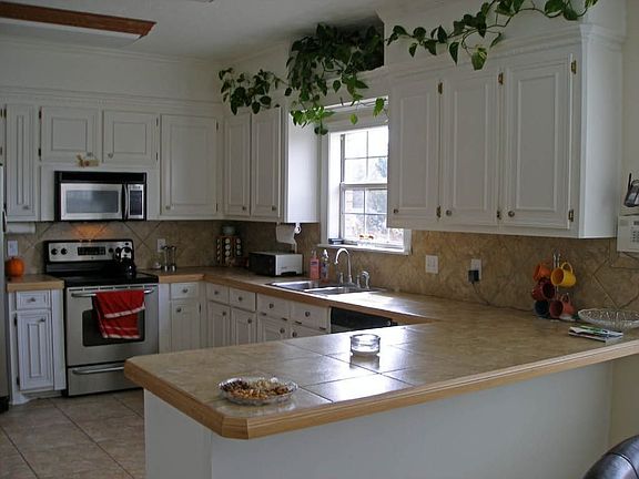 Kitchen w/ceramic countertops and S/S appliances