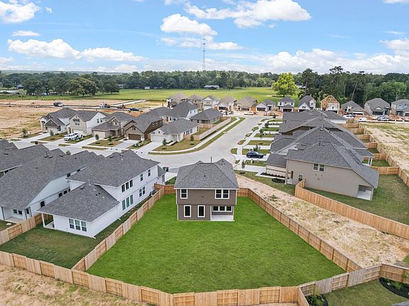 An additional view of your lot and neighborhood with an oversized backyard and lot.