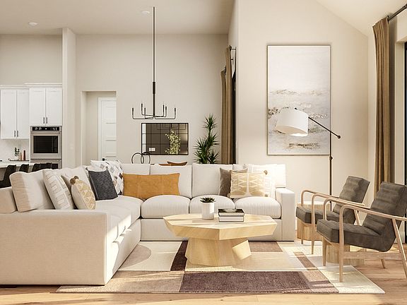 The open living spaces connect the family room with the dining room and kitchen.