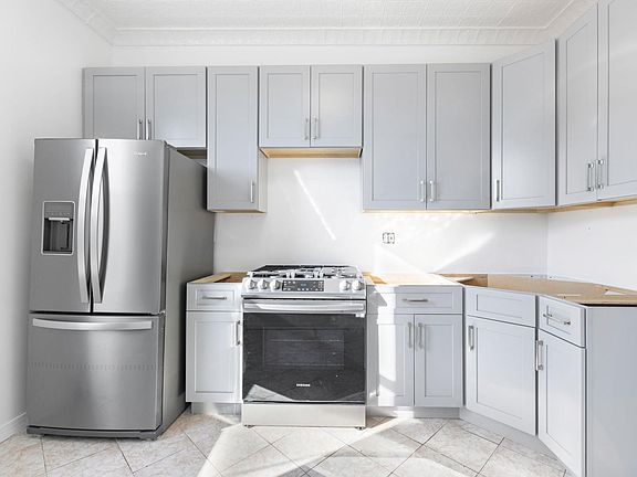The kitchen was fully renovated with new 42 inch cabinets, Quartz countertops, backsplash and an all new anti-finger print stainless steel appliance package.