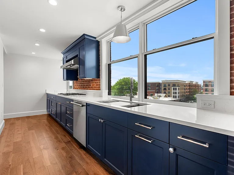 Amazing Dream Kitchen with Grade A+ custom cabinets and exposed brick